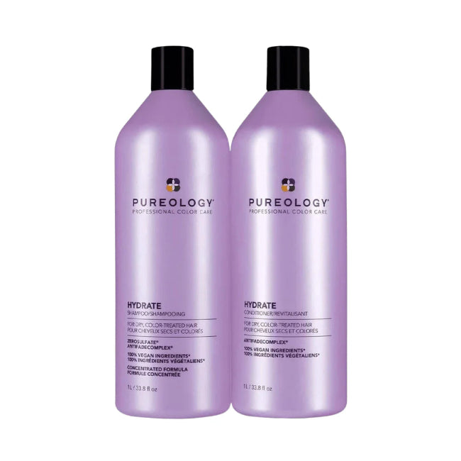 Two bottles of Pureology Hydrate shampoo and conditioner on a white background