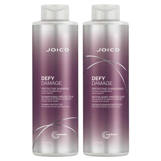 Two Joico Defy Damage shampoo and conditioner bottles on a white background