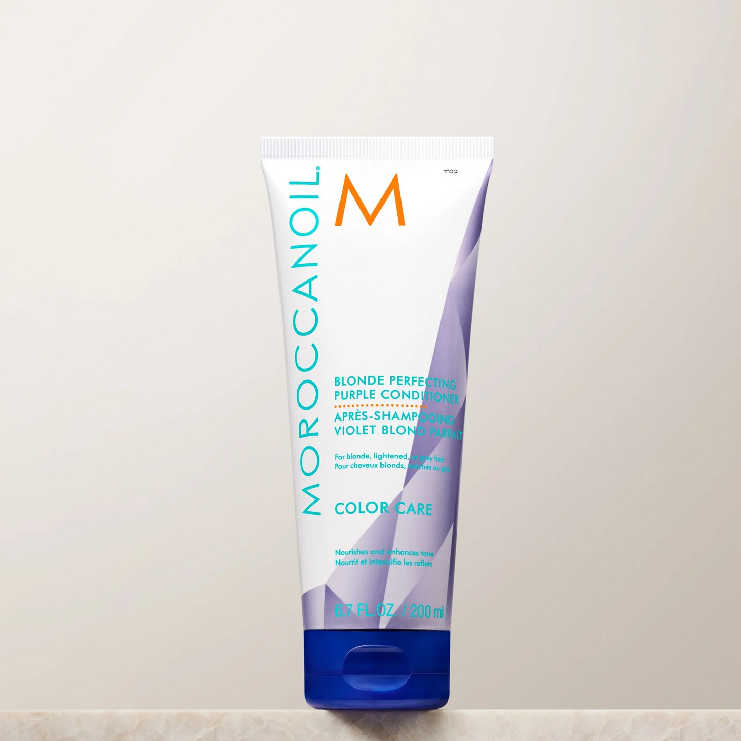 Moroccanoil hair care product on a white background