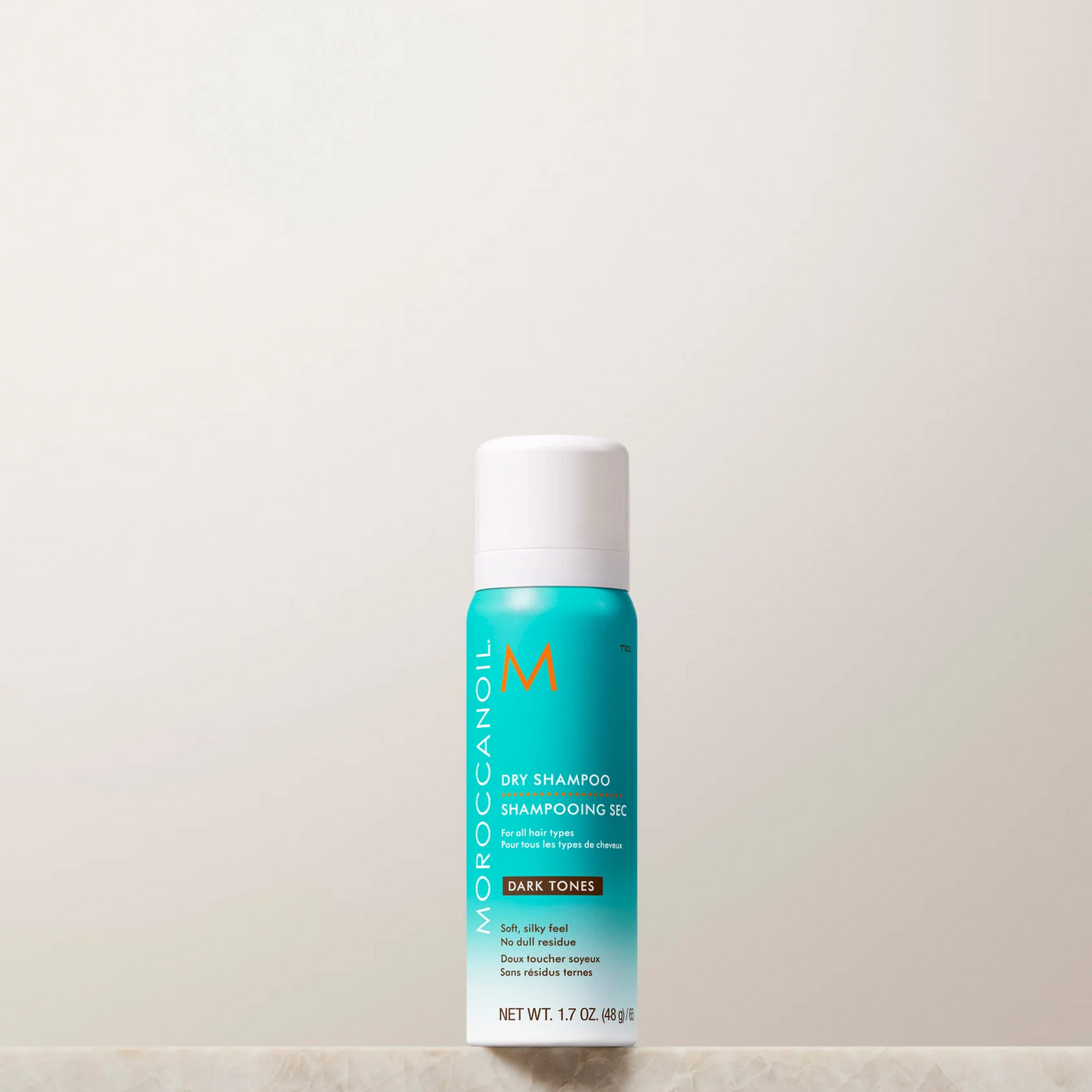 Moroccanoil hair product bottle on a light background