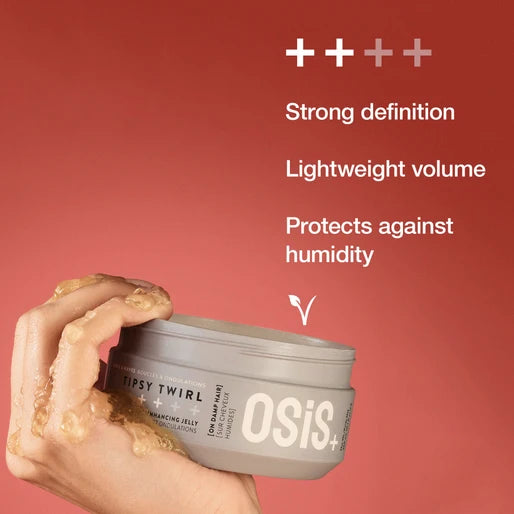 OSiS+ hair product jar with hand holding a dollop of product against a red background