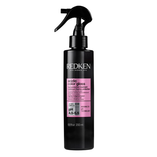 Black bottle of Redken Acidic Color Gloss on a white background