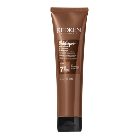 Redken hair care product tube on a white background