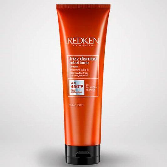 Redken hair care product tube on a white background