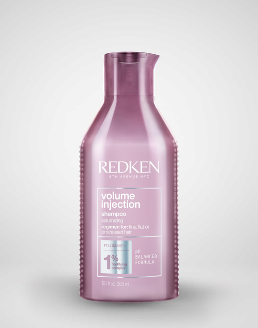 Redken volume injection shampoo bottle on a white background
