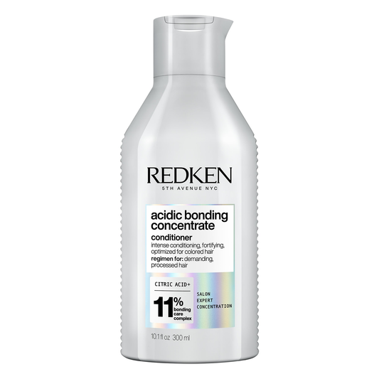 Redken acidic bonding concentrate conditioner bottle on a white background