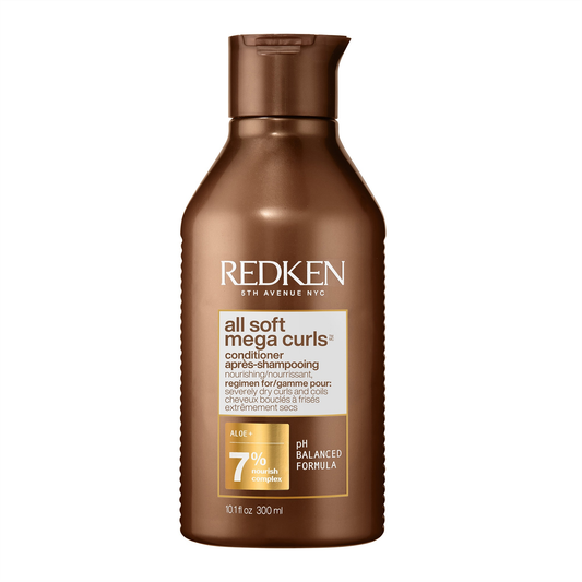 Redken conditioner bottle for mega curls on a white background