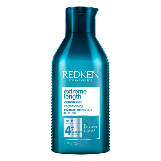Blue bottle of Redken Extreme Length conditioner on a white background