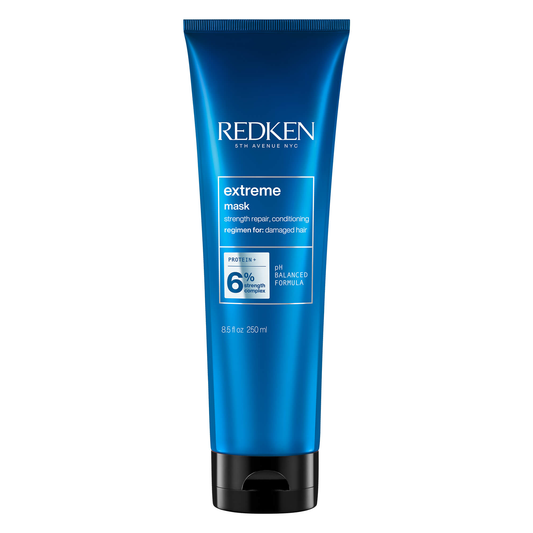 Blue Redken extreme mask tube on a white background