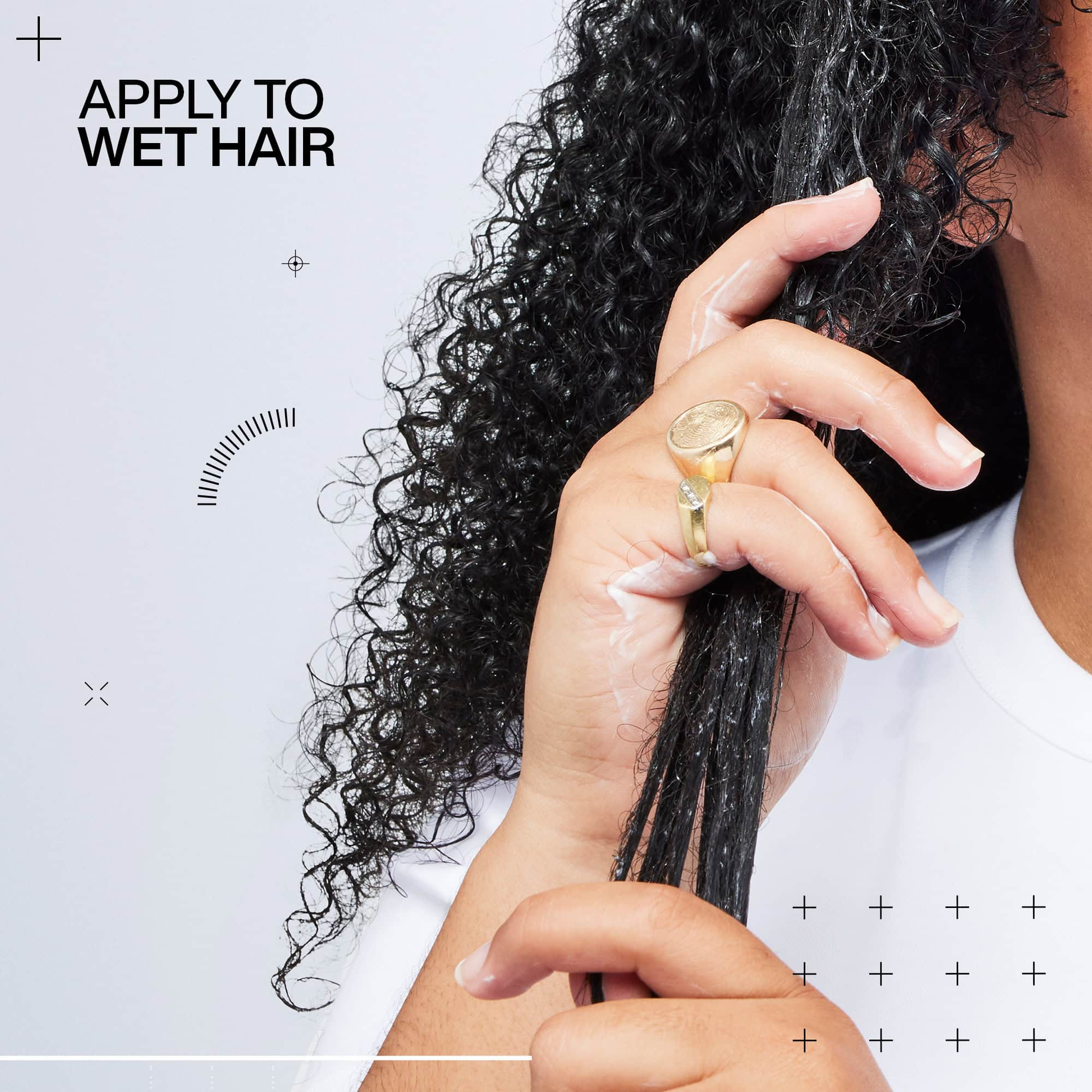 Person holding wet hair with text 'Apply to Wet Hair' on a light gray background