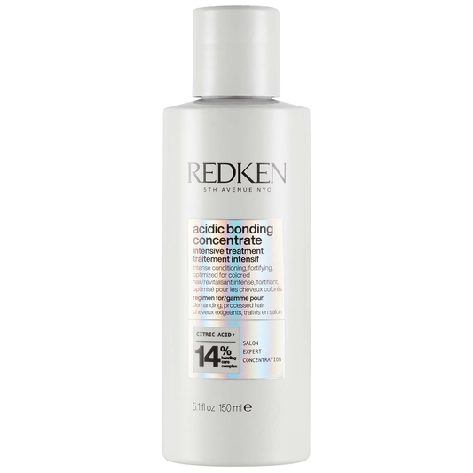Redken bottle of acidic bonding concentrate on a white background