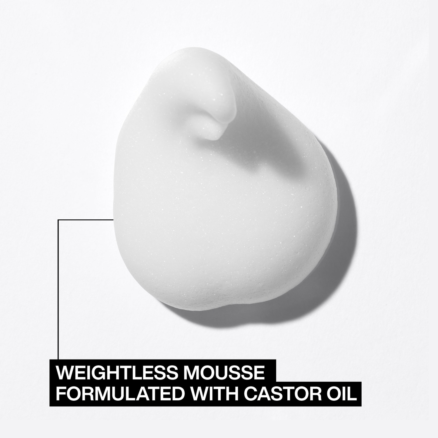 White weightless mousse on a light gray background with text indicating it's formulated with castor oil.
