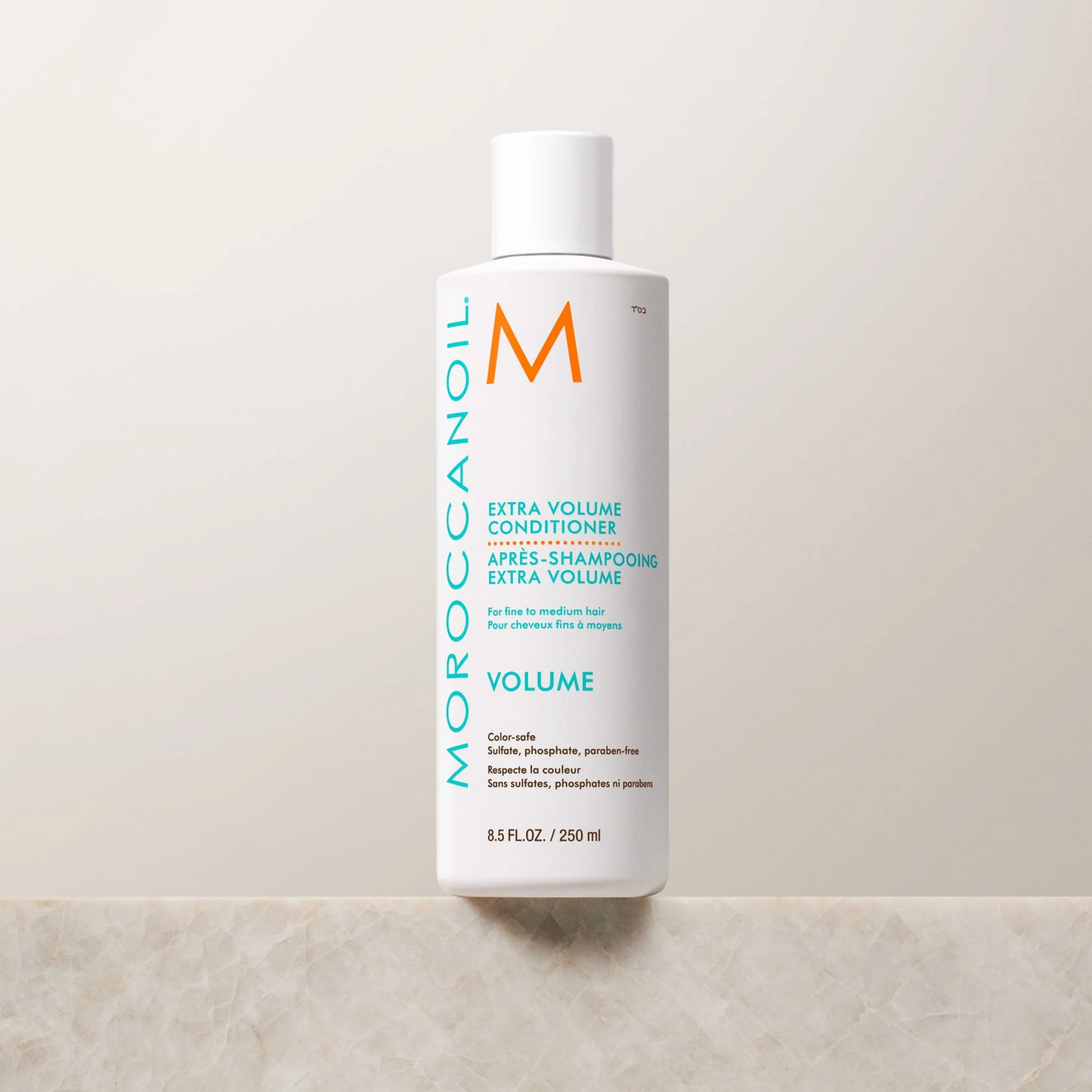 Moroccanoil Extra Volume Conditioner bottle on a light background