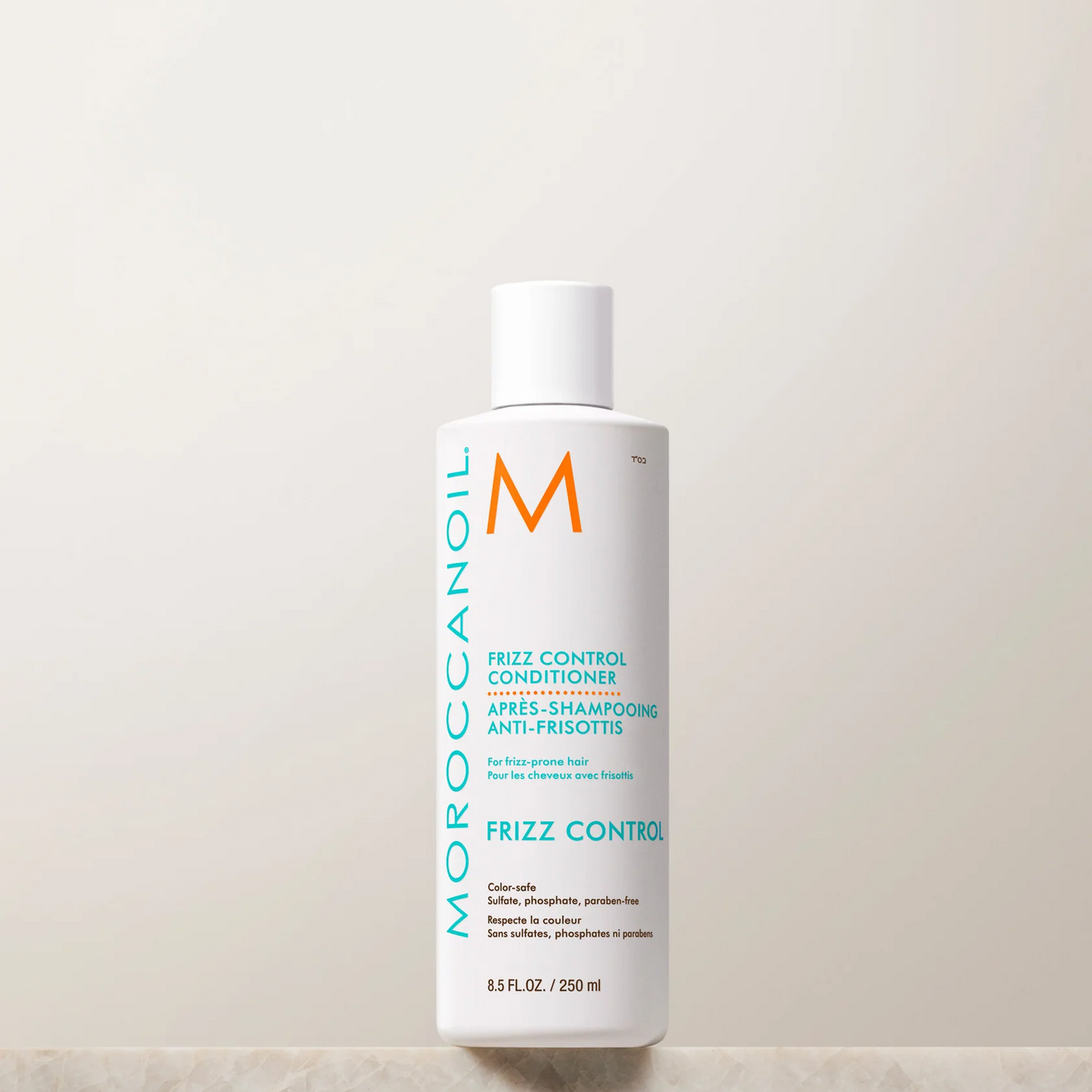 Moroccanoil frizz control conditioner bottle on a light background