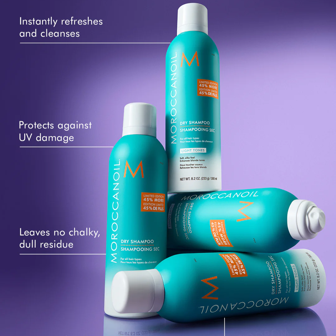 Moroccanoil dry shampoo bottles on a purple background with product features text.