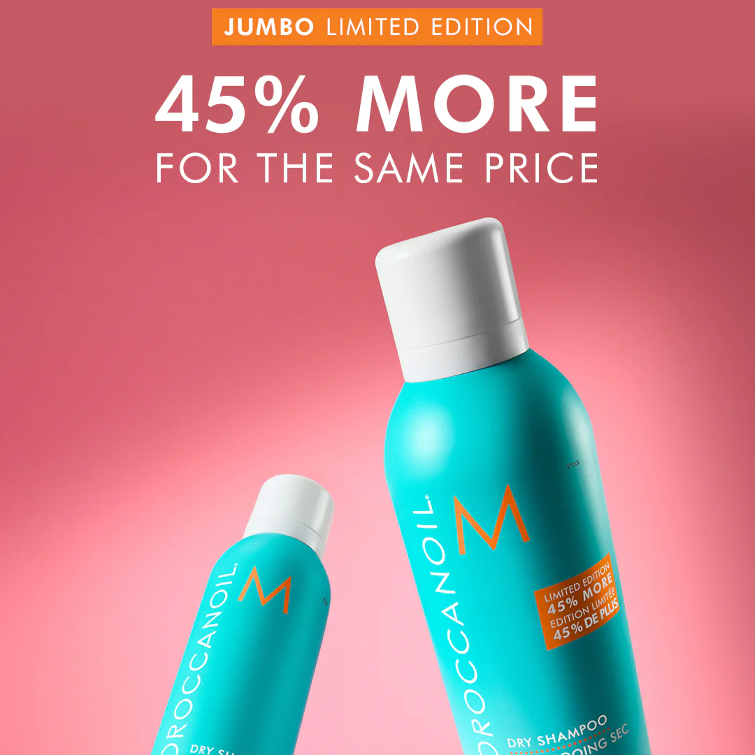 Two bottles of Moroccanoil dry shampoo on a pink background with promotional text.