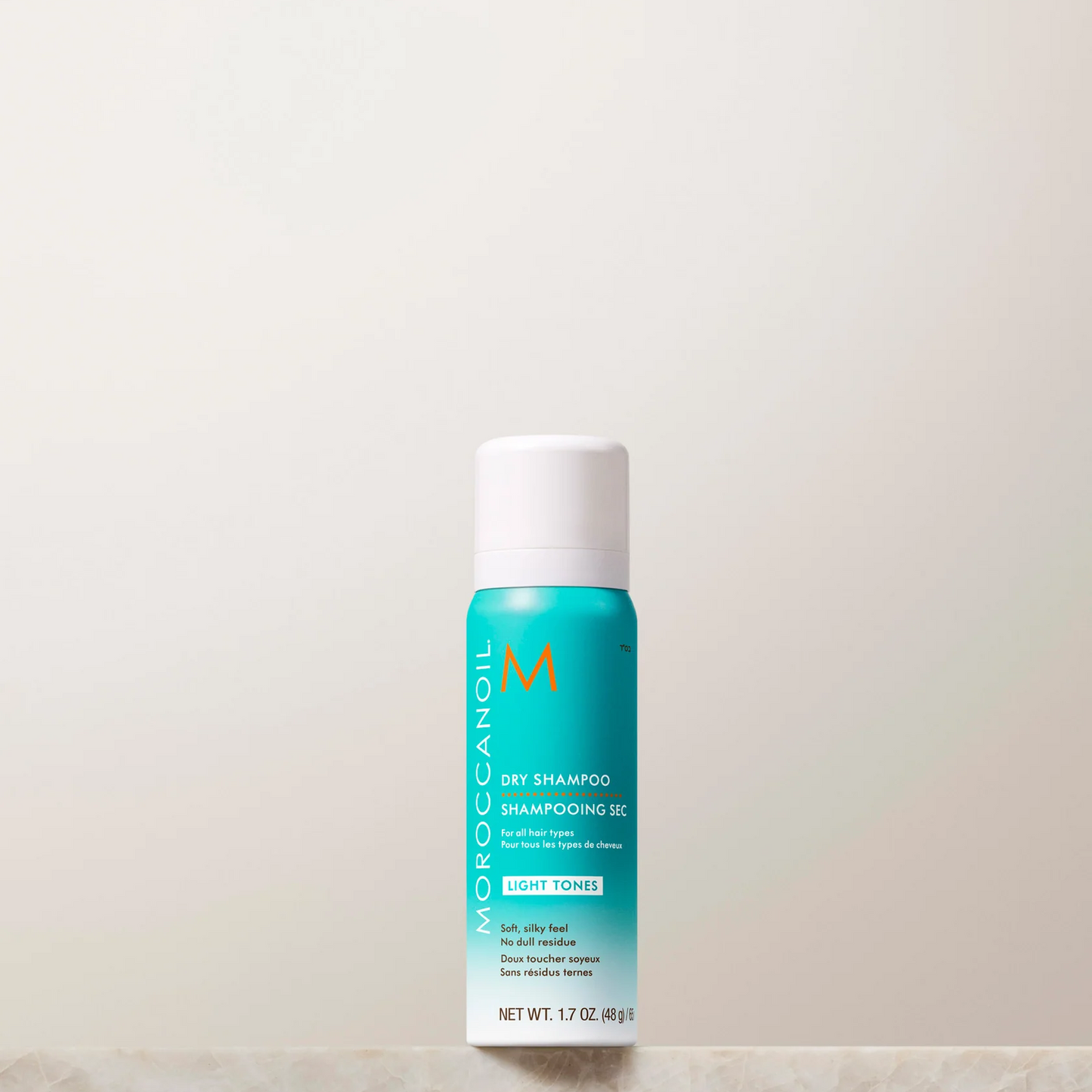 Moroccanoil shampoo bottle on a light background