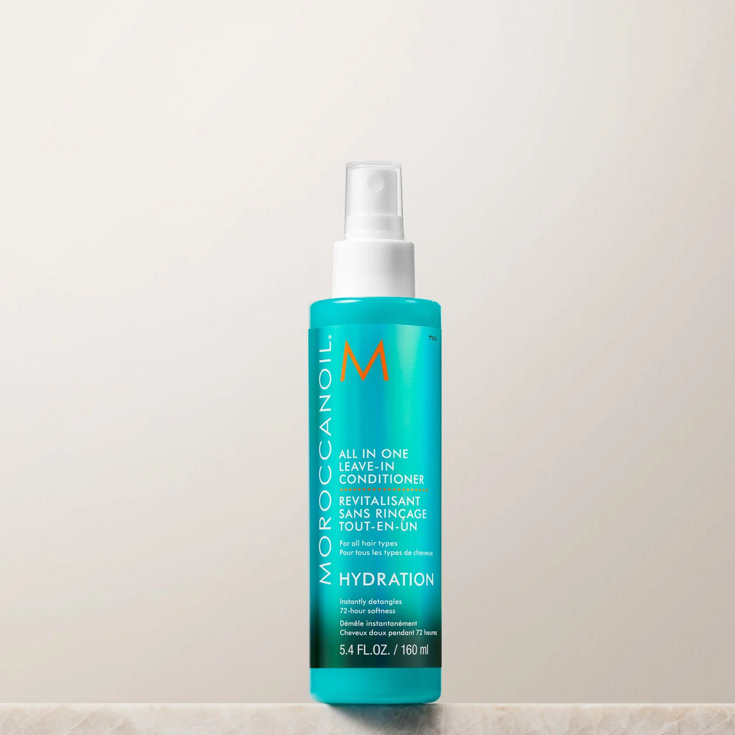 Moroccanoil bottle on a beige background