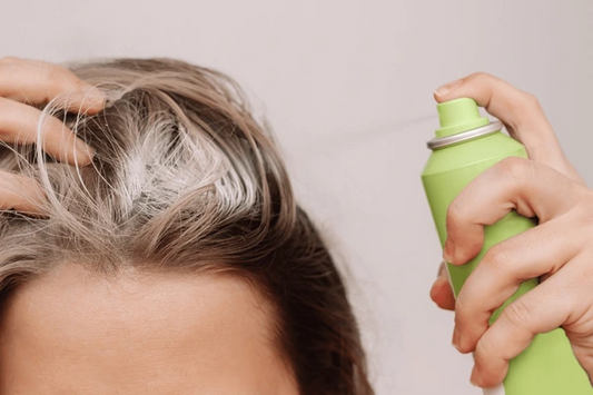 Woman Applying Dry Shampoo To Scalp