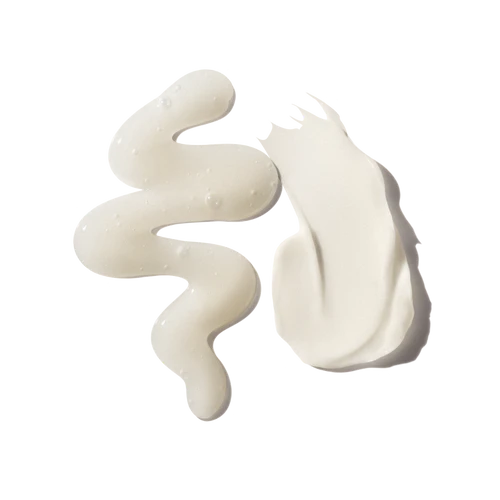 White cream swatches of olaplex shampoo and conditioner on a white background