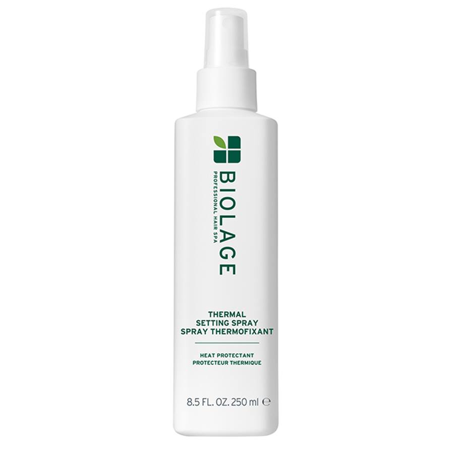 A white bottle of BIOLAGE Thermal Setting Spray Thermofixant with a white spray nozzle, featuring green text and logo on a plain white background.