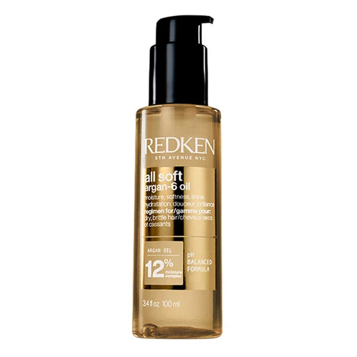 Redken all soft hair oil bottle on a white background