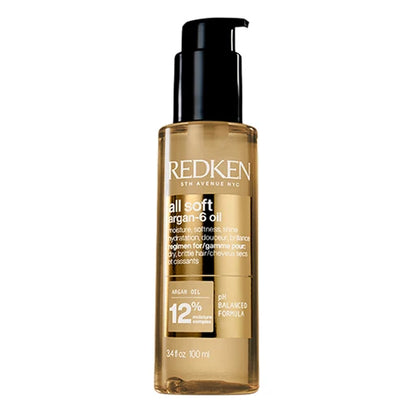 Redken all soft hair oil bottle on a white background