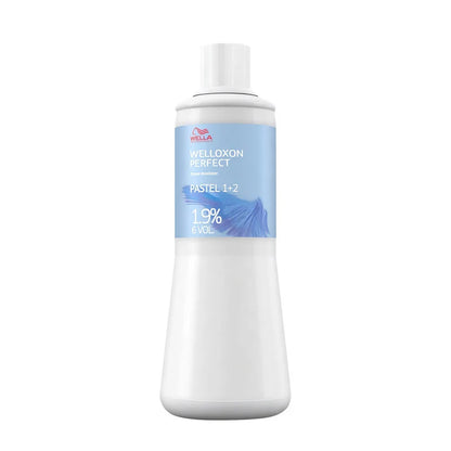 A white bottle of Wella Welloxson Perfect hair developer, Pastel 1+2, with a light blue label, on a solid white background.