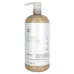 Bottle of scalp care product on a white background