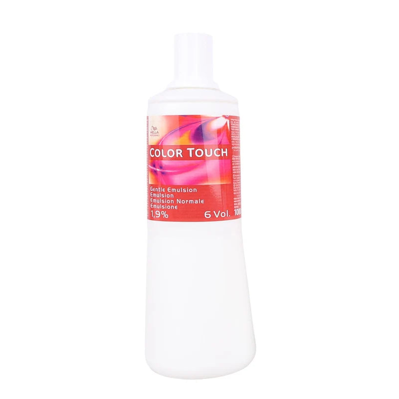A 6 Vol color emulsion bottle with a white plastic body and cap, featuring a red and pink label with the text 'COLOR TOUCH' and '6 Vol'.