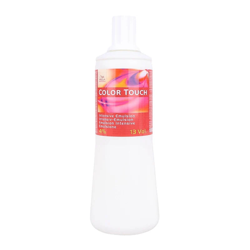 A white plastic spray bottle of Color Touch Intensive Emulsion with a pink and orange label, shown on a plain white background.