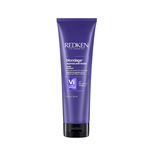 Purple Redken hair care product tube on a white background