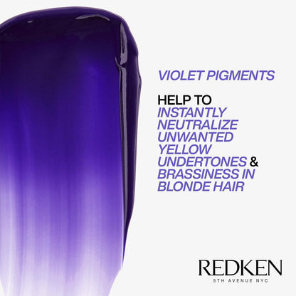 Close-up of a purple hair product with text about violet pigments from Redken.
