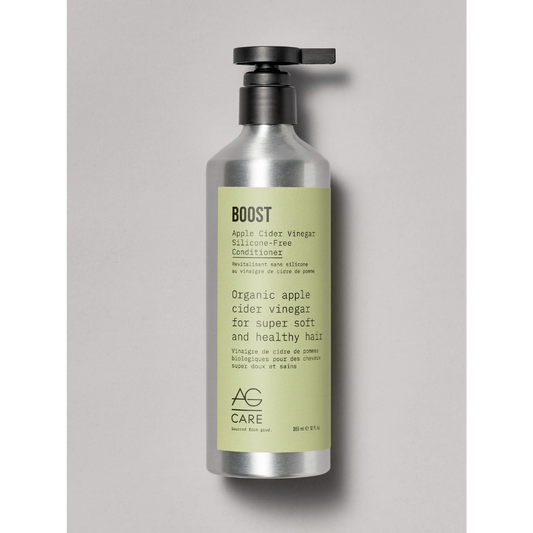Bottle of AG Care Boost conditioner on a gray background
