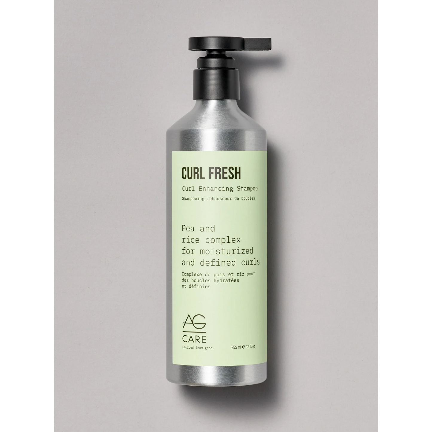 Curl Fresh shampoo bottle with pump on a gray background