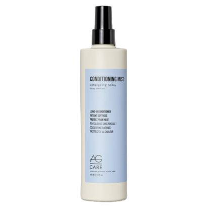 Hair care product bottle with a white body and black nozzle on a white background