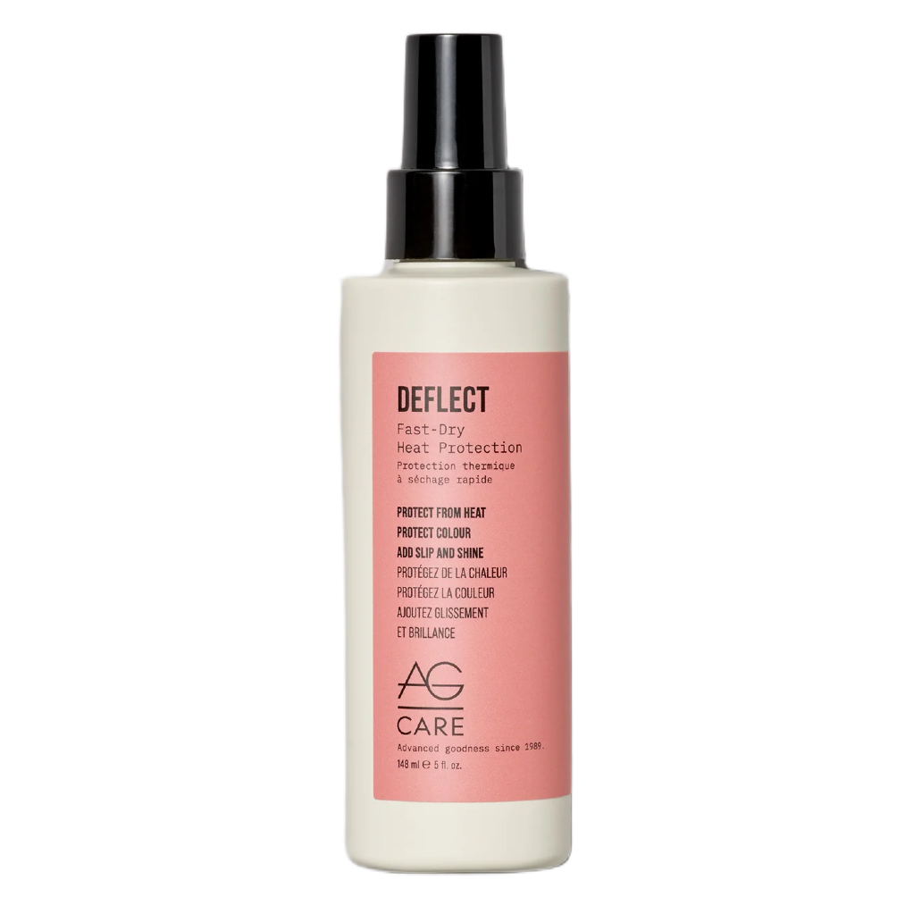 Hair care product bottle with pink label on a white background