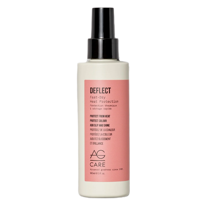 Hair care product bottle with pink label on a white background