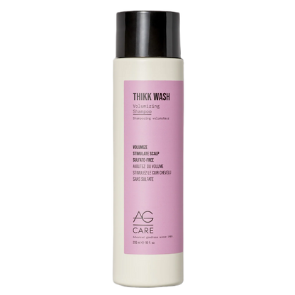 Shampoo bottle with pink label on a white background