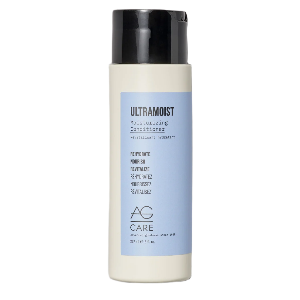 Shampoo bottle with black cap and blue label on a white background