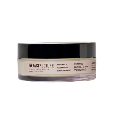 Jar of hair product labeled 'Infrastructure' on a white background