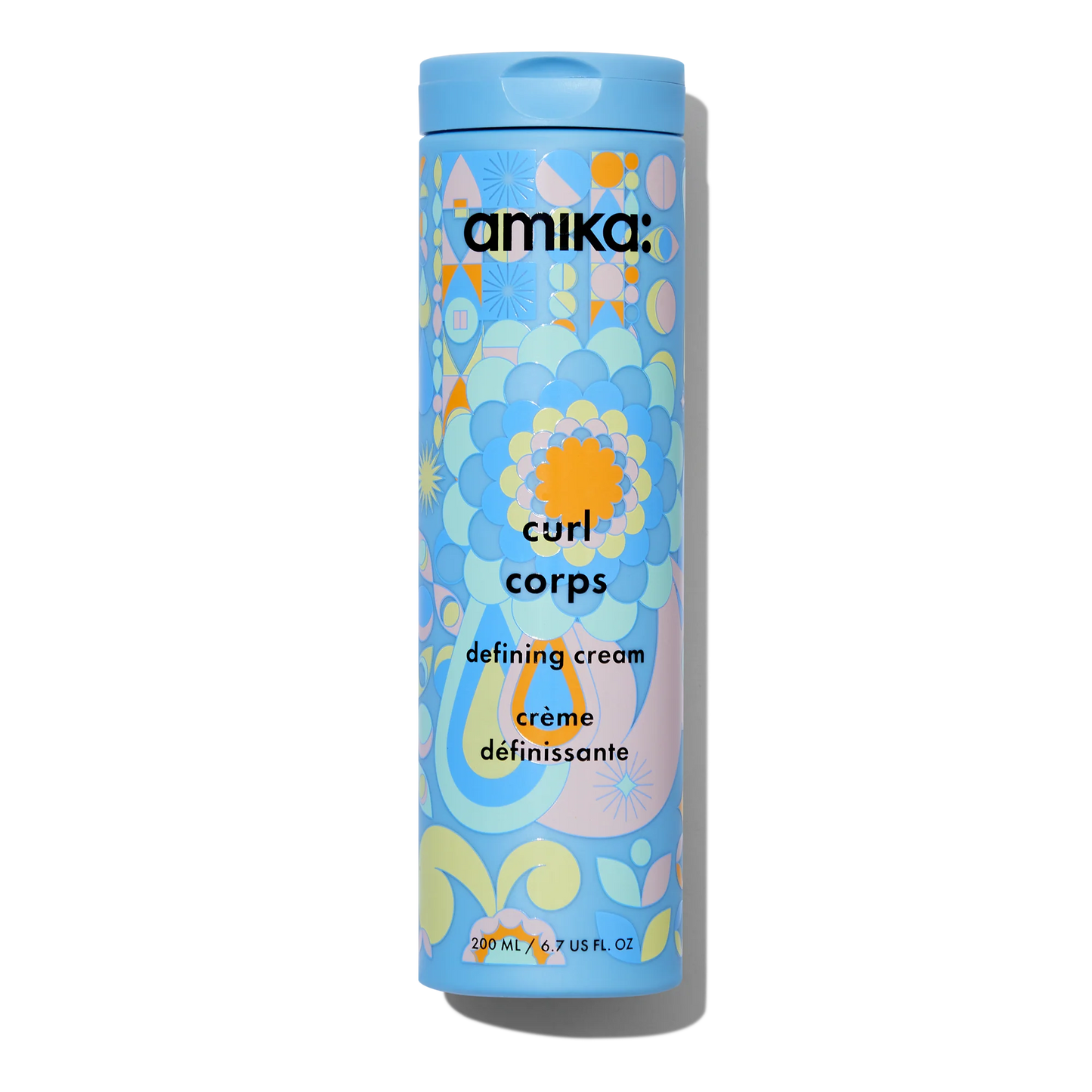 Amika Curl Corps defining cream container with colorful design on a white background
