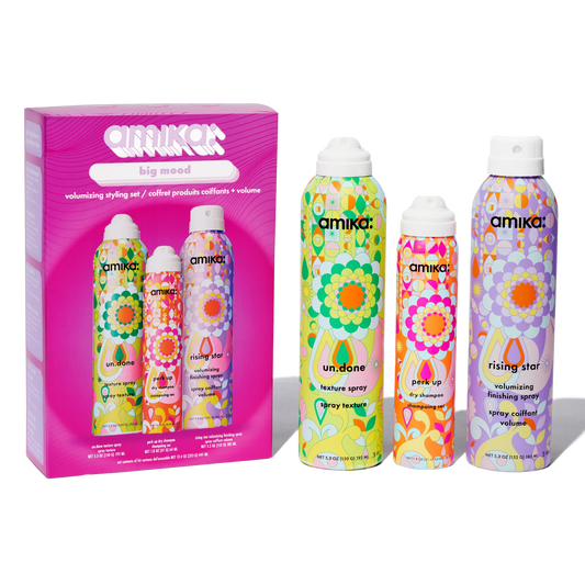 Amika hair product set with colorful packaging on a white background
