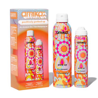 Amika dry shampoo set with colorful packaging on a white background