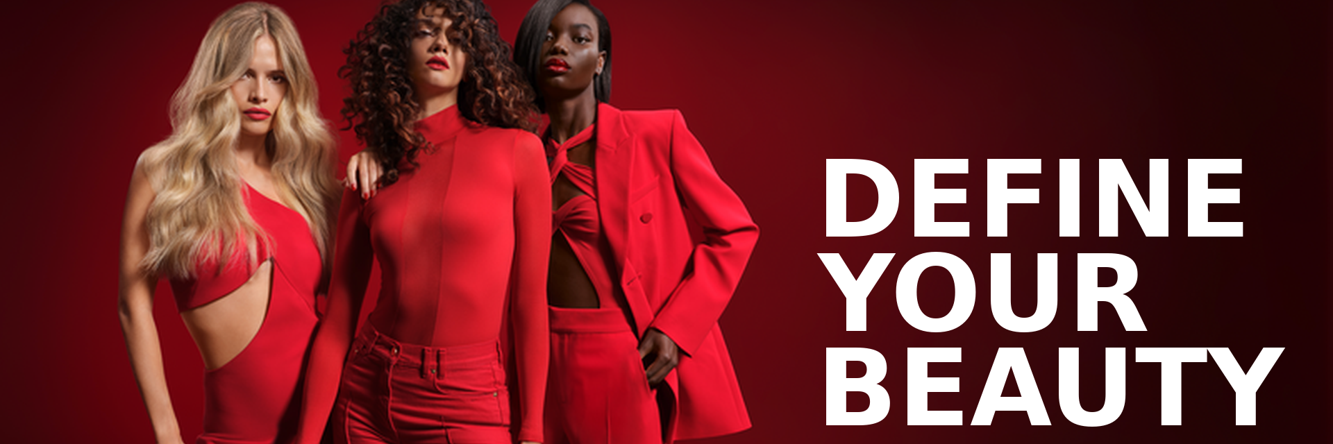 Three women in red outfits against a red background with 'Define Your Beauty' text.