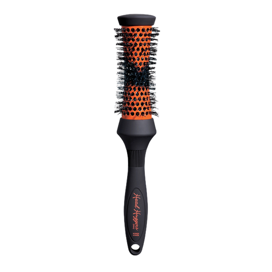 Hairbrush with black and orange bristle design on a white background