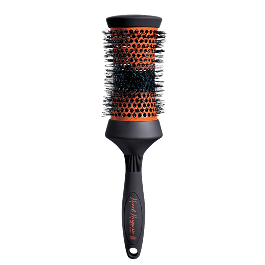 Hairbrush with black and orange bristle head on a white background