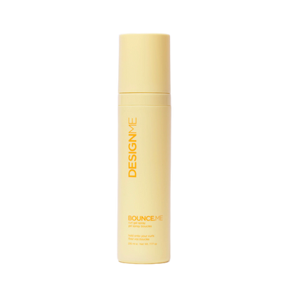 Yellow bottle of DesignMe product on a white background