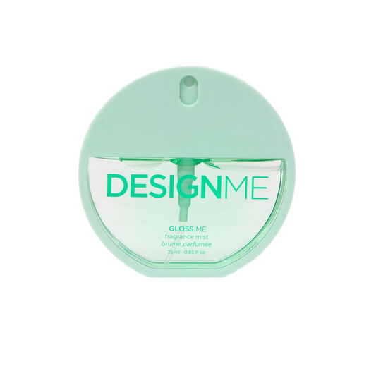 A round, mint green fragrance mist bottle with a clear lower half showing the liquid inside, and the brand name 'DESIGNME' printed on the front.