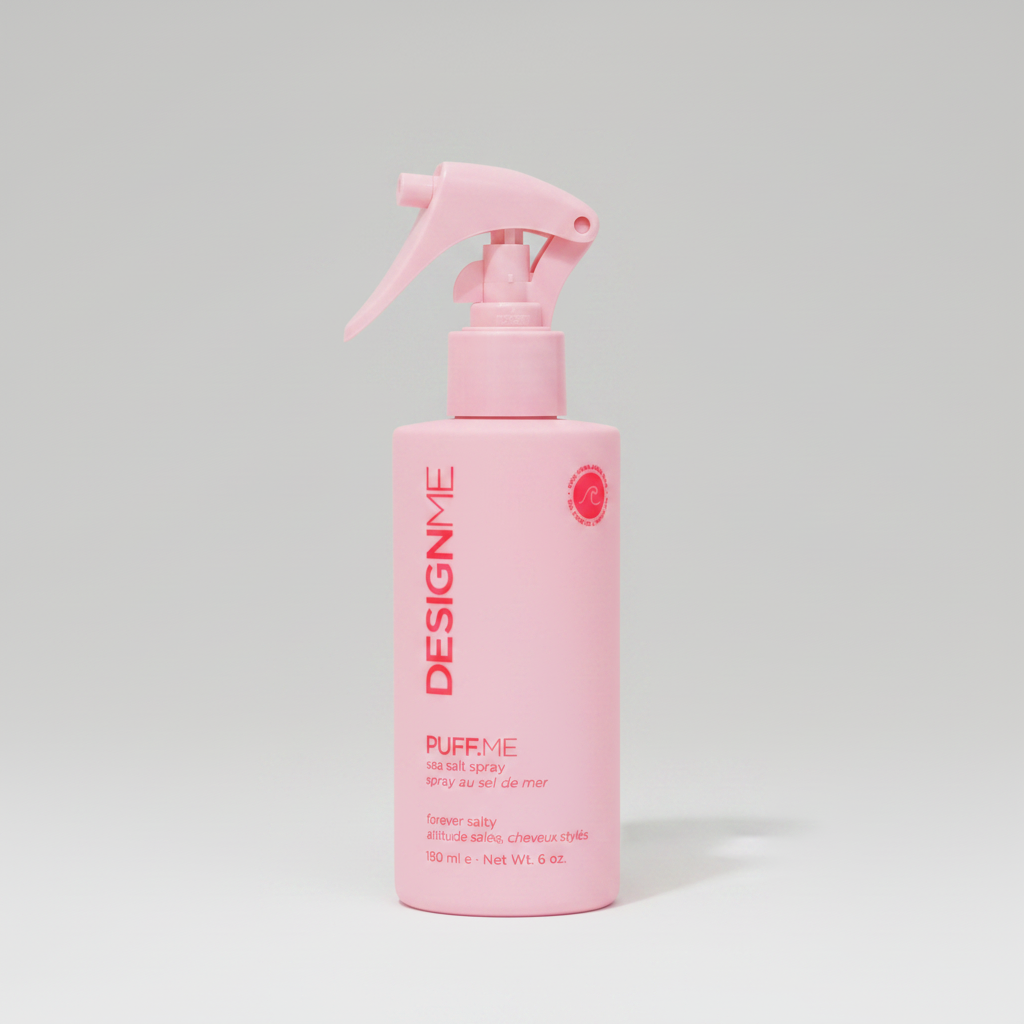 Pink spray bottle with 'Design Me' branding on a white background